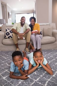 Portrait of happy family spending leisure time at home