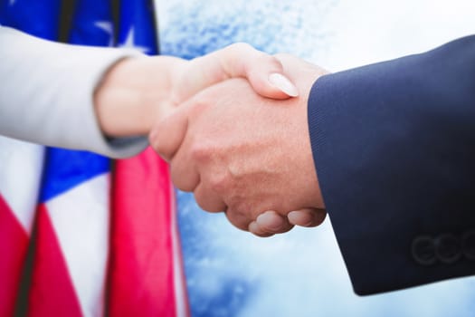 business people doing handshake against full frame shot of cloudy sky