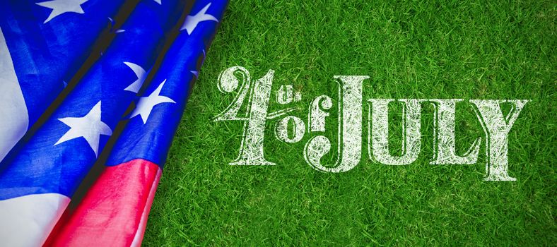 Happy 4th of july text on white background against closed up view of grass