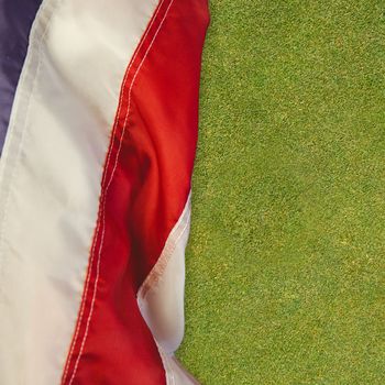 US flag against green background
