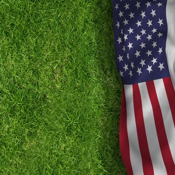 American flag against closed up view of grass