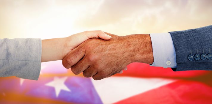 Business people shaking hands on white background against composite image of creased us flag