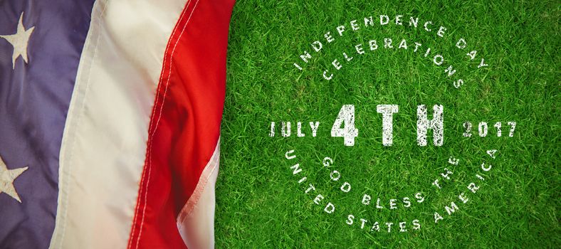 Multi colored happy 4th of july text against white background against closed up view of grass