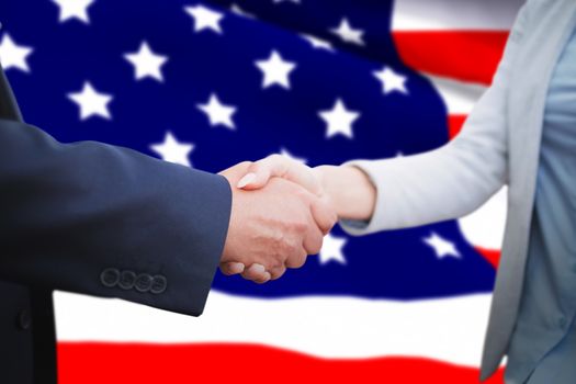 Corporate people doing handshake against highly detailed 3d render of an american flag