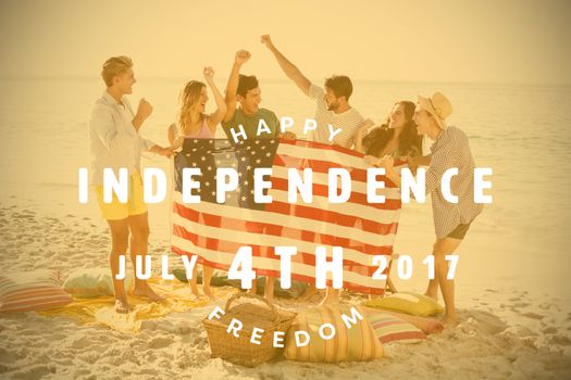 Computer graphic image of happy 4th of july text against happy group of friends at the beach