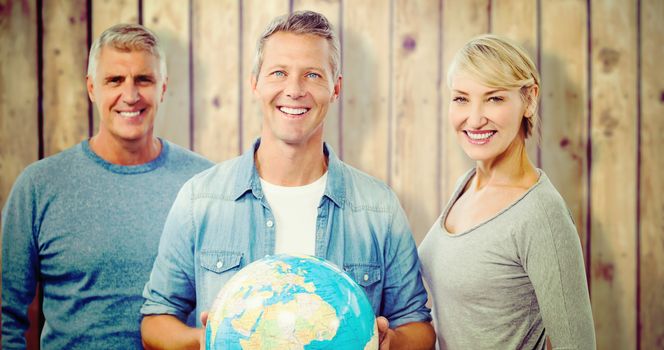 Portrait of people with globe  against wooden planks