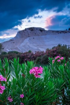 Pamukkale, Turkey – 07.15.2019. Pamukkale white Mountain on a cloudy summer morning.