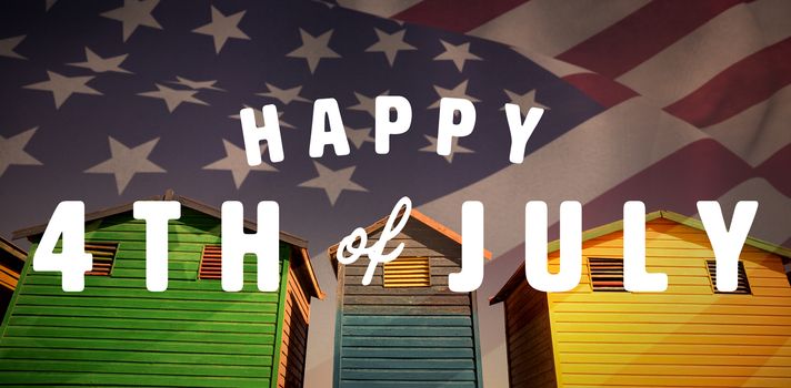 Digitally generated image of happy 4th of july text against low angle view of multi colored houses against sky