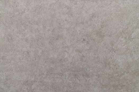 Taupe abstract grungy decorative texture. Textured paper with copy space. Motley gray-brown paper surface, texture closeup.