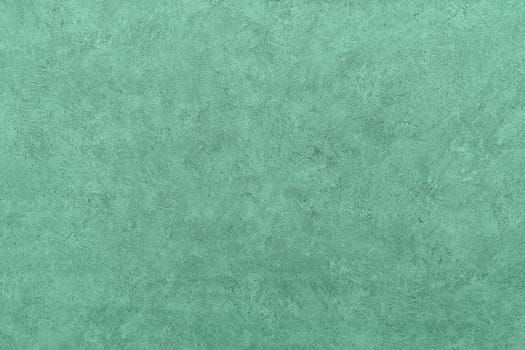 Abstract grungy decorative texture. Textured paper with copy space. Motley green paper surface, texture closeup.