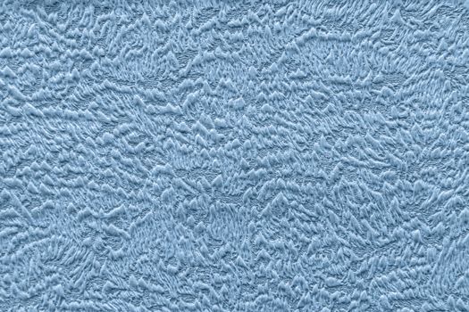 Abstract grungy decorative texture. Textured paper with copy space. Motley surface of blue paper, texture closeup.