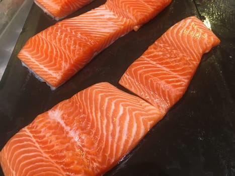 Salmon fillets on the stone Making the fish look more prominent by the color of the fish meat In a store