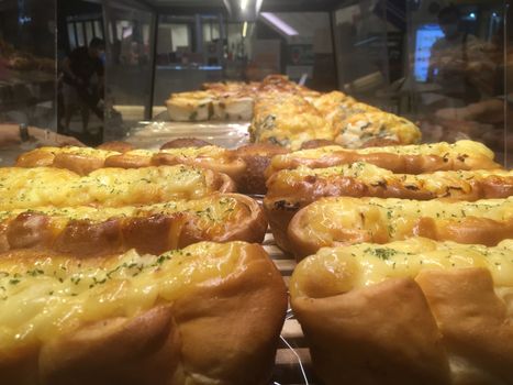 Delicious bakery pastries on trays in stores