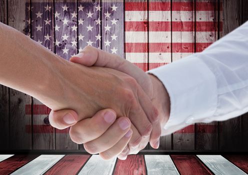Digital composite of People shaking their hands against american flag