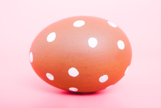 Beautiful Easter Brown egg color on pink background, Easter day concept