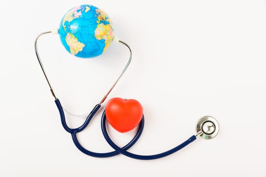 World health day concept, Stethoscope, globe and red heart on white background with copy space. Global health care