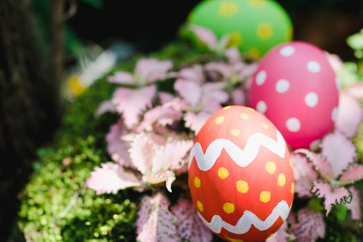 Beautiful Easter Multi color egg on garden, Easter day concept