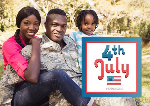 Digital composite of Smiling family siting on the grass for the 4th of july