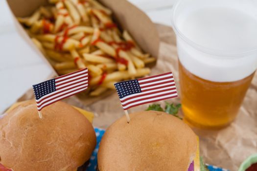 Close-up of snacks and drink decorated with 4th july theme