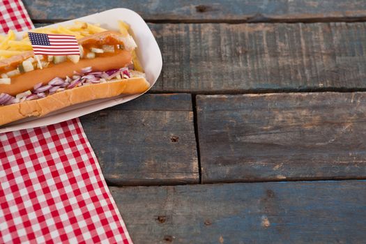 Hot dogs decorated with 4th july theme on wooden table