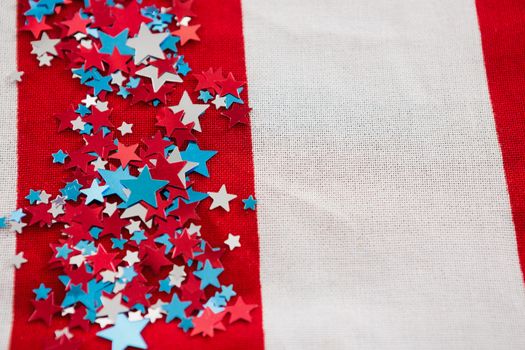Star shape decoration arranged on American flag with 4th july theme