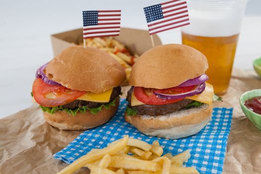 Hamburgers decorated with 4th july theme on brown paper