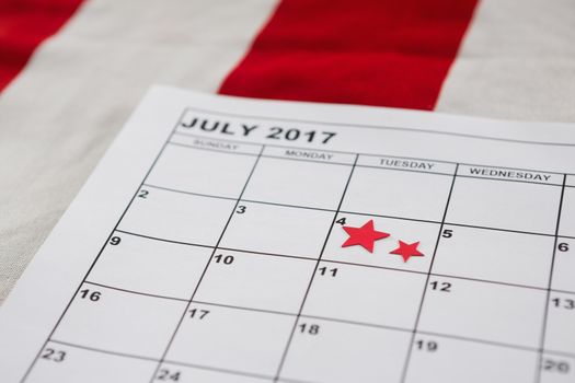 Calendar marked with star shape decoration with 4th july theme