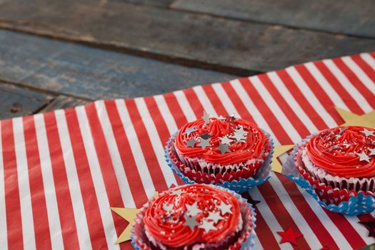 Decorated cupcakes with 4th july theme on wooden table