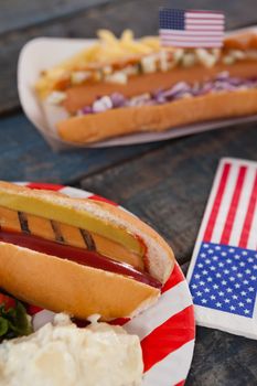 Close-up of hot dog served in plate with 4th july theme