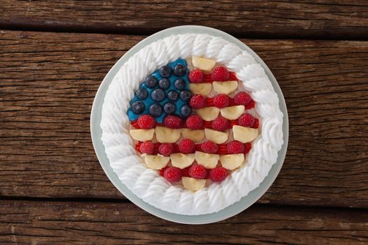 Fruitcake with 4th july theme on wooden table