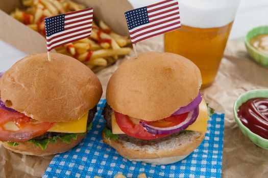 Hamburgers decorated with 4th july theme on brown paper