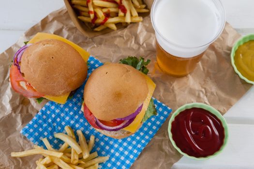 Drink and snacks decorated with 4th july theme on wooden table