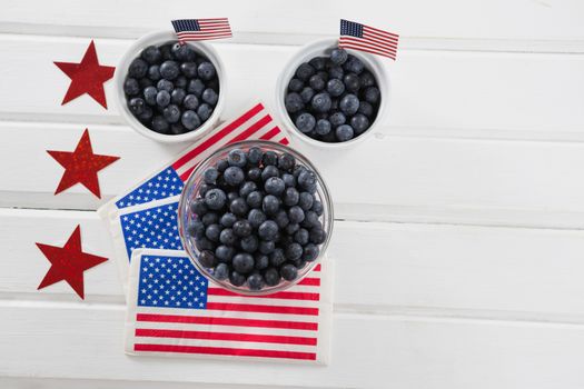 Black berries decorated with 4th july theme on wooden table