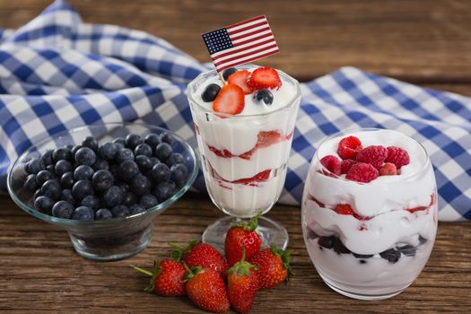 Close-up of fruit ice cream on wooden table with 4th july theme