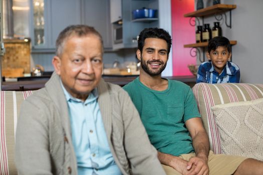 Portrait of family in living room at home