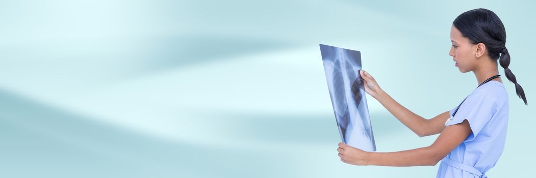 Digital composite of Doctor with x-ray against blue abstract background