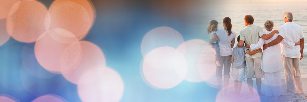 Digital composite of Back family at beach with blue and orange bokeh transition