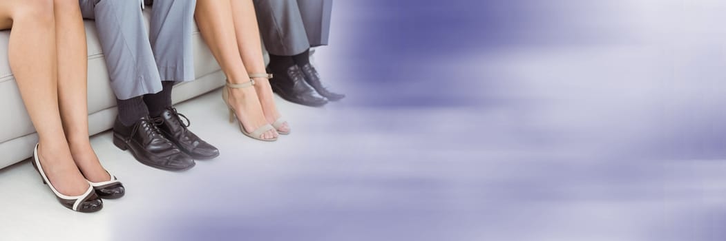 Digital composite of Close up of business people legs on couch with blurry purple transition