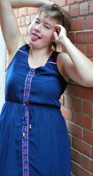 Plus size female beauty fashion model expressions outdoors.