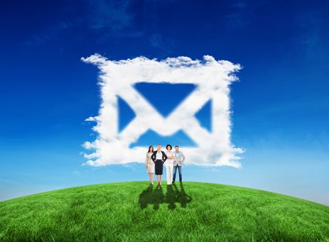 Composite image of business team looking at camera against cloud email
