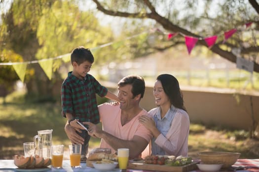 Happy family enjoying together in the park on a sunny day