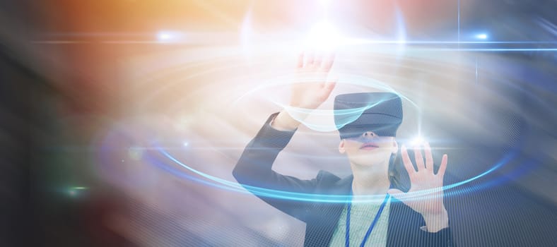 Businesswoman gesturing while wearing virtual reality glasses against abstract glowing black background