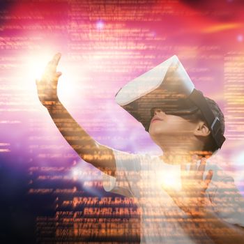 Boy using virtual reality simulator glasses against vector image of illuminated orange light 