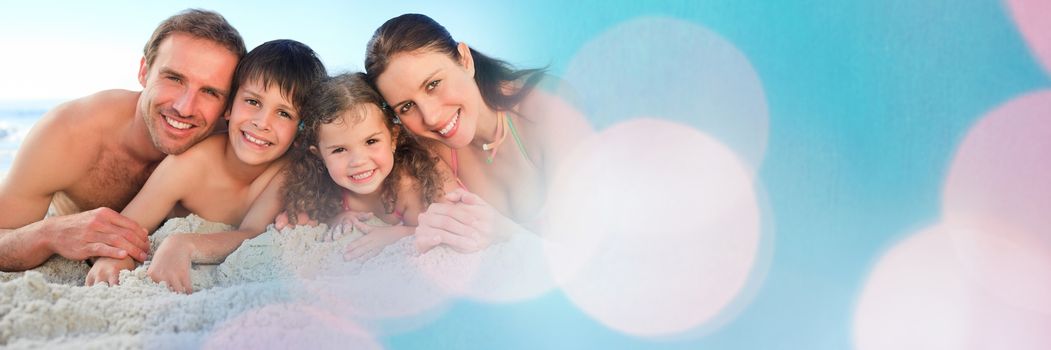 Digital composite of Family lying on beach smiling at camera wide shot