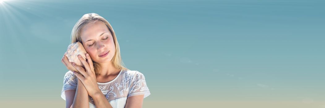 Digital composite of Millennial woman with shell against Summer sky with flare