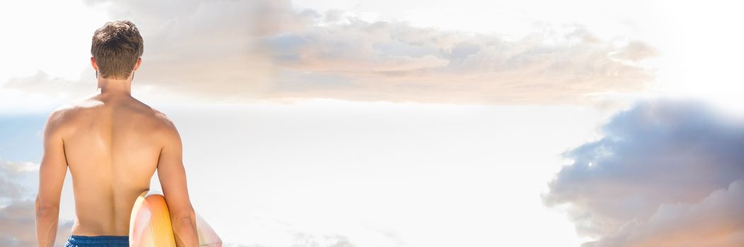 Digital composite of Back of surfer against Summer sky