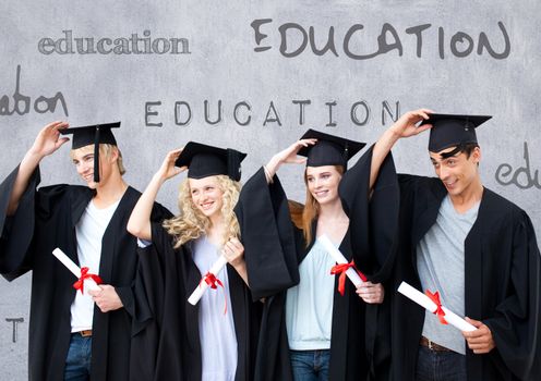 Digital composite of Group of graduates standing in front of education text