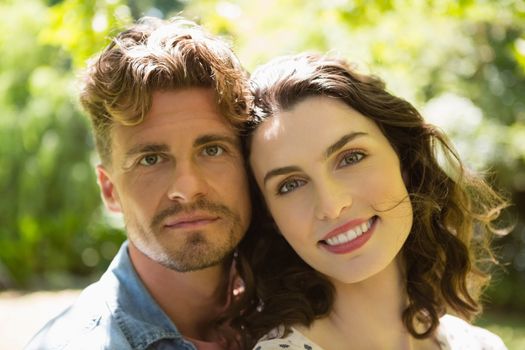 Portrait of romantic couple in garden on a sunny day