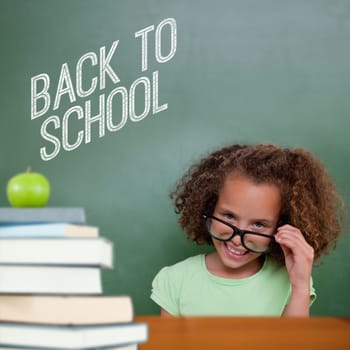 Cute pupil tilting glasses against back to school message