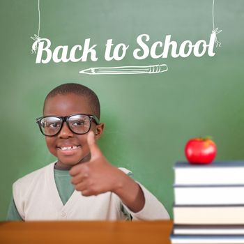 Cute pupil showing thumbs up against back to school message